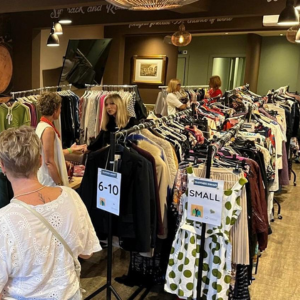 Clothes rails with sizes marked on the ends of each rail